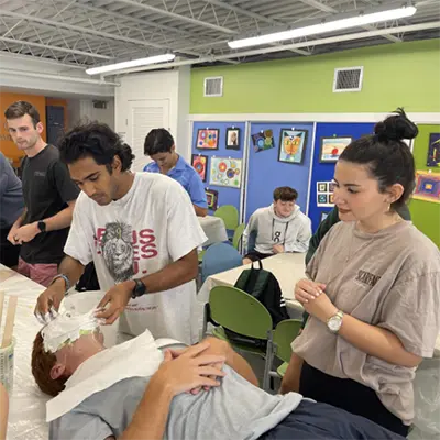 Students making face masks in the Death and Dying course